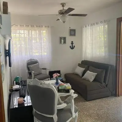 a living room with a couch and a table and chairs at Casita Linda Playas Rios Wifi Agua HOT AC and more in Paraíso