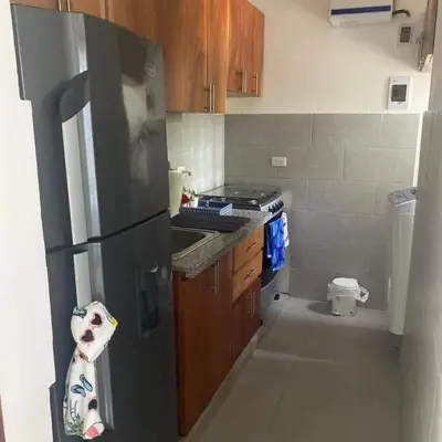 a kitchen with a stainless steel refrigerator and a stove at Casita Linda Playas Rios Wifi Agua HOT AC and more in Paraíso