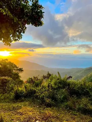 a view of the hills with the sun setting in the distance at Casita Linda Playas Rios Wifi Agua HOT AC and more in Paraíso