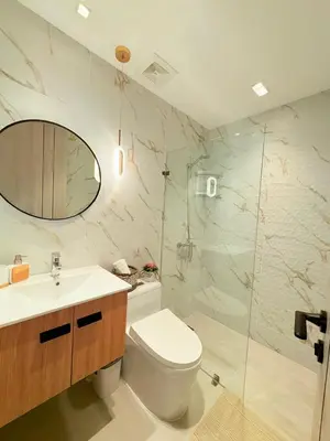 a bathroom with a toilet and a sink and a shower at Apartment in Evaristo Morales, National District in Santo Domingo