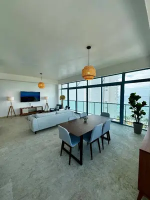a large living room with a bed and a table at Juan Dolio 2BR Apt Beach front in Juan Dolio