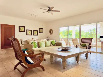a living room with a couch and a table at Oceanfront PH Jacuzzi Balconies of the Atlanti in El Limón