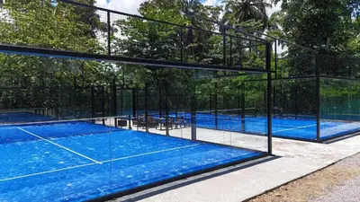 a swimming pool with a tennis court in a building at Oceanfront PH Jacuzzi Balconies of the Atlanti in El Limón