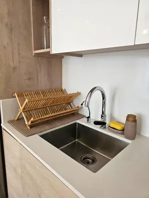 a kitchen with a sink and a counter top at Aqua Esmeralda Beachfront Apartment Trinidad 103 in La Laguna
