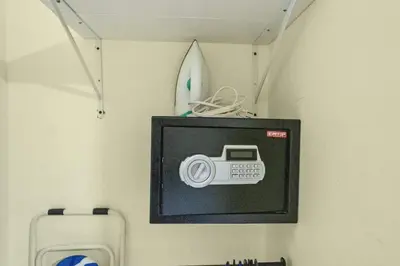 a picture of a camera on a wall with a surfboard at Cheap Hotel Room in Sosua Center in Sosúa