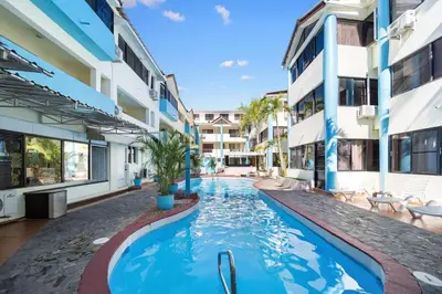 a swimming pool in the middle of a building at Cheap Hotel Room in Sosua Strip in Sosúa