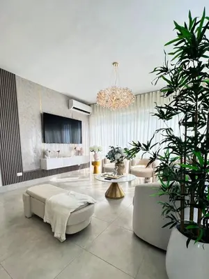 a living room with a couch and a table at Majestic 2Bd Ocean view Apartment Boca Del Mar III in Boca Chica