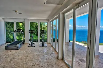 an empty gym with a view of the ocean at Spectacular Ocean View 1-Bedroom Condo, Vista Mare, Samana, DR in Villa Ramfis