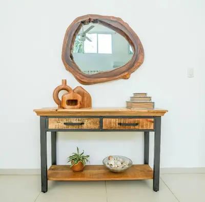 a console table with a mirror on the wall at Lux villa playa bonita in Las Terrenas