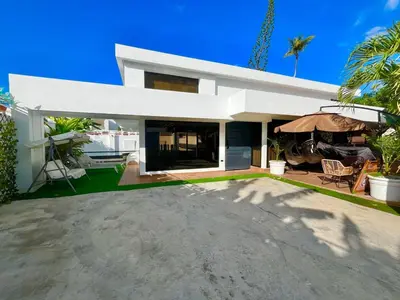 a large white house with a large driveway at Villa fantastica Pool privada y centrica in Las Terrenas