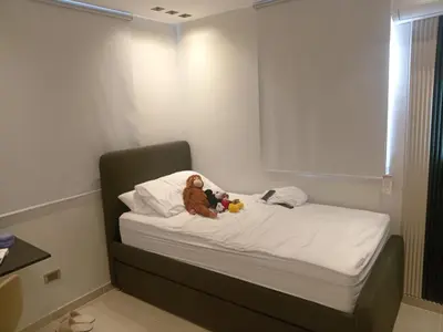 a small bed with two stuffed animals sitting on it at Ecológica in Los Paredones