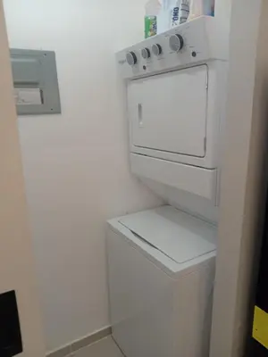 a white washer and dryer in a white kitchen at Ecológica in Los Paredones