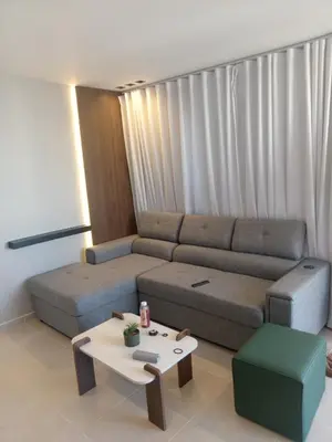 a living room with a couch and a coffee table at Ecológica in Los Paredones