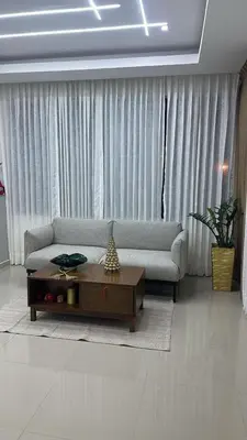 a living room with a couch and a coffee table at Hotel Evers in Azua