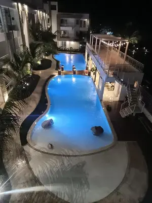 an overhead view of a swimming pool at night at Cozy tiny home by the beach in La Laguna