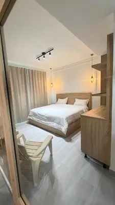 a bedroom with a bed and a chair in it at Hotel Juan Dolio in Juan Dolio