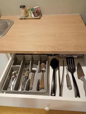 a drawer filled with utensils under a kitchen counter at Mejor, Quédate Aquí in Las Galeras