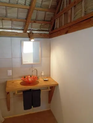 a bathroom with a wooden counter with a sink at Mejor, Quédate Aquí in Las Galeras
