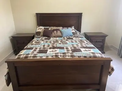 a bedroom with a bed with a quilt on it at Villa Reyes Vega - Private Pool & BBQ - La Colonia, SC in La Cabirma
