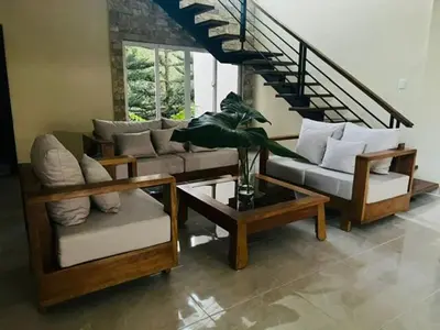a living room with a couch and a table at Villa Reyes Vega - Private Pool & BBQ - La Colonia, SC in La Cabirma