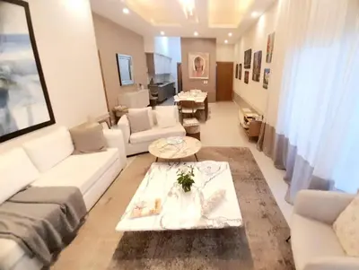 a living room with a couch and a table at Luxury 3-Bedroom Apartment with Pool in Naco, Santo Domingo in Santo Domingo