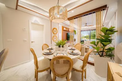 a dining room with a table and chairs at Aqua Luxe Opulence Vista Piscina & Golf · by Sun5 in Punta Cana