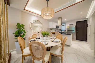 a dining room with a table and chairs at Aqua Luxe Opulence Vista Piscina & Golf · by Sun5 in Punta Cana