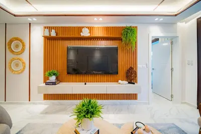 a living room with a flat screen tv on a wall at Aqua Luxe Opulence Vista Piscina & Golf · by Sun5 in Punta Cana
