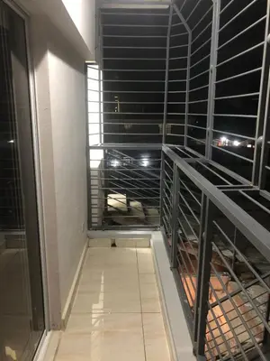 an empty room with black racks in a building at Apartamento acogedor en Santo Domingo este in Hainamosa
