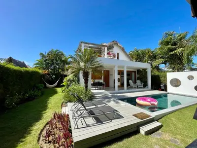 a house with a swimming pool and a yard at Villa Leon Azul in La Iglesia