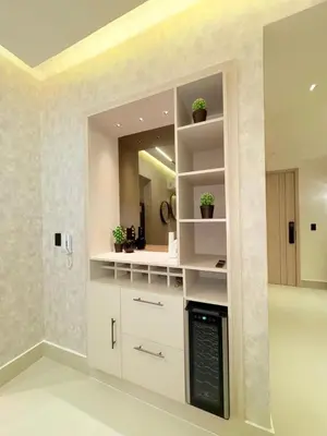 a kitchen with white cabinets and a mirror at Apartment in Downtown, DN in Colorado