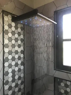 a bathroom with a shower with a shower curtain at Encuentro Vaquero in Jarabacoa
