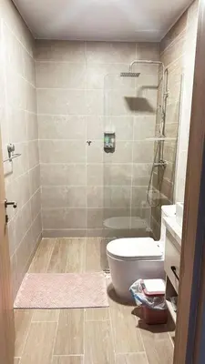 a bathroom with a shower with a toilet and a sink at Beautiful apartment Bavaro Beach in Punta Cana