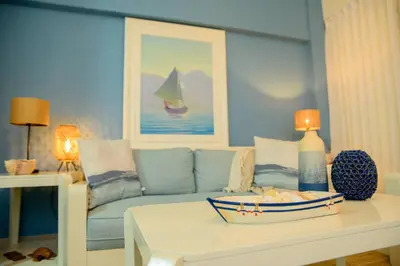 a living room with a couch and a table at Stunning Beachfront 2BR Condo in Juan Dolio in Juan Dolio