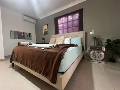 a bedroom with a large bed in a room at Casa Villa para grupos grandes in Ciruelitos Arriba