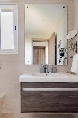 a bathroom with a sink and a mirror at Cana Pearl in Punta Cana