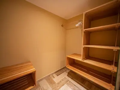 a walk in closet with wooden shelves at North Coast Luxury Villa in Sosua - 6BR Suites in Sosúa