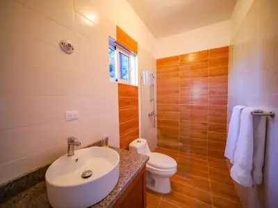 a bathroom with a sink and a toilet at 8BR Private Villa in Sosua 2 mins from Nightlife in Sosúa
