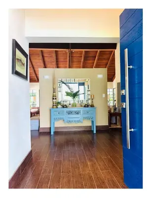 a room with a blue table in a room at Casa De Campo Beautiful Villa with AC in the all house steps from the beach in La Romana