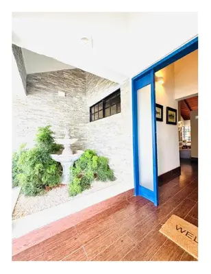 a building with a fountain in the middle of a hallway at Casa De Campo Beautiful Villa with AC in the all house steps from the beach in La Romana