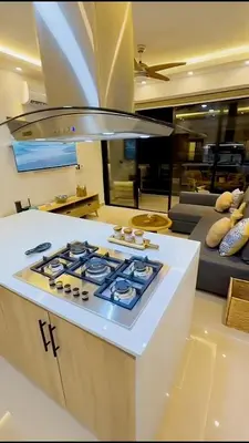a kitchen with a stove top oven in a room at Caribbean Dream Bayahibe Seaside 3Br Penthouse in Bayahibe