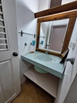 a bathroom with a sink and a mirror at villa vue mer in Las Terrenas