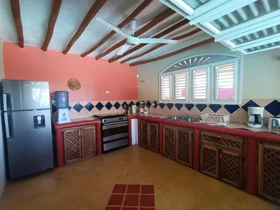 a large kitchen with a refrigerator and a stove at villa vue mer in Las Terrenas