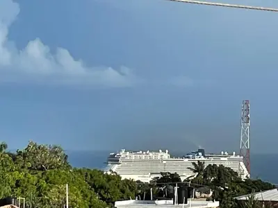 a large white cruise ship in the ocean at Royal Terrace Queen 1 in San Felipe de Puerto Plata