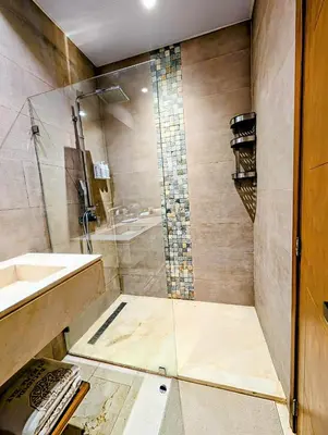 a bathroom with a shower and a sink at Beautiful Apartment overlooking Samaná Bay