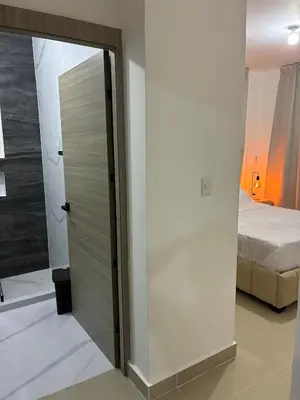 a door in a room with a bed and a bedroom at Residential hammock 2, next to the brewery in Concepción de La Vega