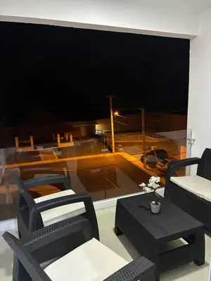 a room with a large window with chairs and a table at Residential hammock 2, next to the brewery in Concepción de La Vega