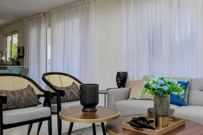 a living room with a couch and chairs and a table at A Tropical Oasis - Vista Canas Villa Vista in Punta Cana