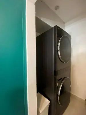 a bathroom with a washer and dryer in a room at A space designed for you in San Cristóbal