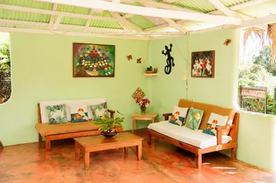 a living room with two couches and a table at Las Mariposas in Las Galeras